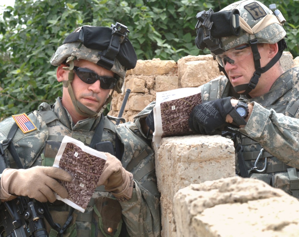 Sgt. 1st Class Brian Krcelic and Staff Sgt. Phanton from 1st Platoon, Alpha Company, 1st Battalion, 187th Infantry Regiment, 101st Airborne Division, discuss the progress of the mission while on patrol in Laq Laq, Iraq on April 11, 2006. The purpose of the mission was to gather intellegence on locals residing in the area. (Us Army photo by Spc. Charles W. Gill, 55th Combat Camera) (Released)